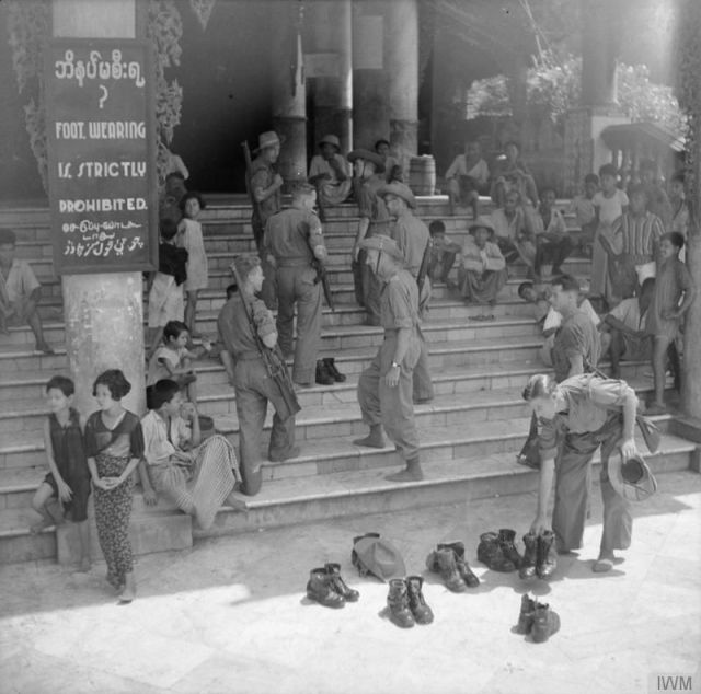 Soldiers remove their shoes at the Shwedagon Pagoda in Rangoon, 1945